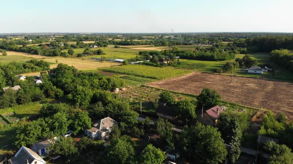  Aerial View of the Countryside and Small Village with Green Fields and Meadows alt