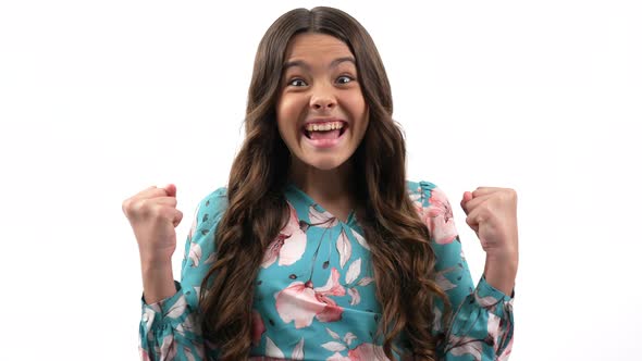 Glad Teen Girl with Long Curly Hair Expressing Gladness After Perfect News Glad and Happy alt