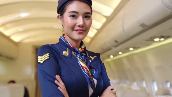 Cabin Crew or Air Hostess Working in Airplane alt