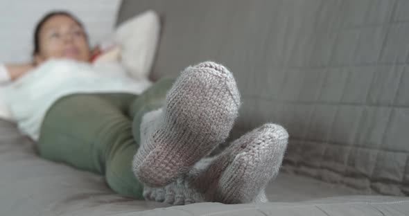 Wool socks on woman feet.  alt