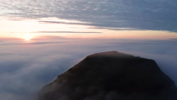 Aerial View of the Mountains in the Clouds at Sunset