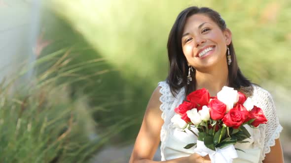 Portrait of bride at wedding holding bouquet alt