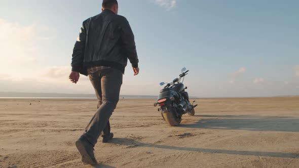 Motorcyclist Doing Tire Burnout in the Desert Slow Motion alt