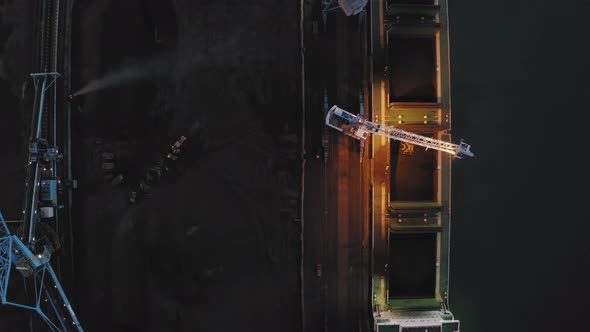 View From the Drone Vertically Down to the Loading of Coal on the Ship alt