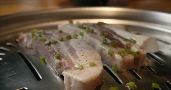 Grill, Tasty Beefsteak Slow Motion Close Up. Chief Using the Tong and Turning the Meat on the Grill alt