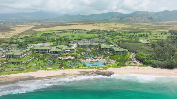 Aerial View of Kauai Island on Hawaii Showing Luxury Resort Blue Turquoise Beach alt