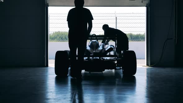 Racing Car is Getting Wheeled Out of the Garage alt