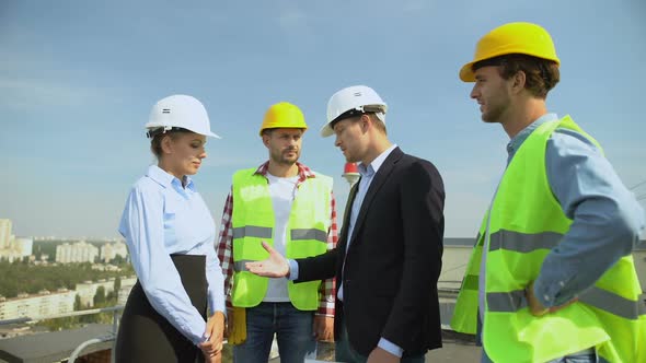 Young Man in Suit Shaking Female Contractor Hand Standing Building Roof, Service