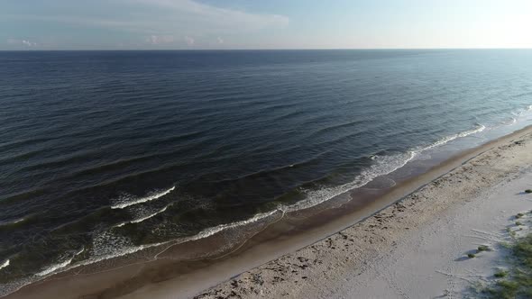 Waves Lap Along the Shore of the Gulf of Mexico in St. George Island, Florida. alt
