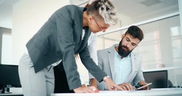 Portrait of Architects Having Discussion in Office alt
