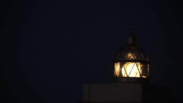 Lighthouse with Beacon Light in the Night.