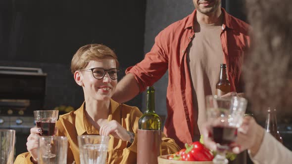 Several Friends Having Dinner alt