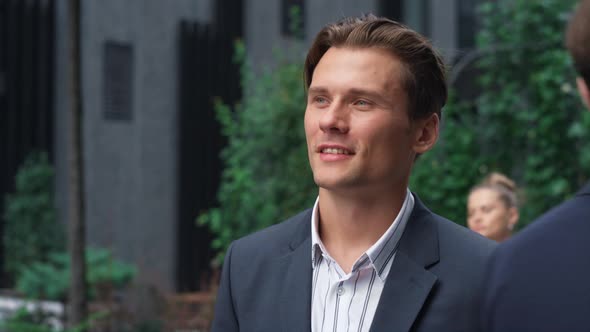 Smiling Businessman Walking Street Inspecting Busy Downtown Area Portrait alt