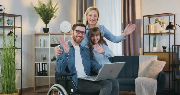 Modern Family in Wheelchair which Posing on Camera alt