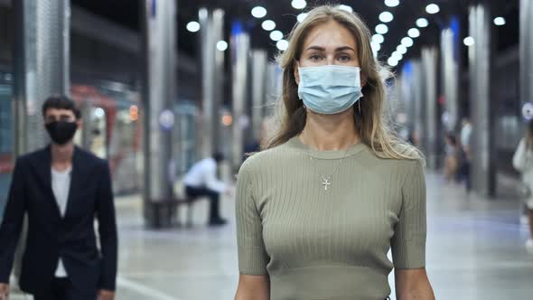 Crowd Masked Face Walking in Station Metro Coronavirus. Woman in Subway Covid-19 alt