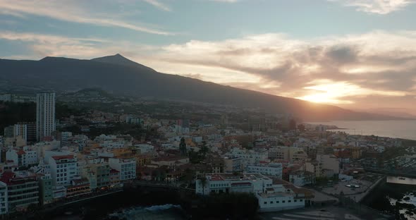 Aerial Panorama of Puerto De La Cruz Resorts and Pools Surrounded By Sea Waves on Sunset Tenerife alt
