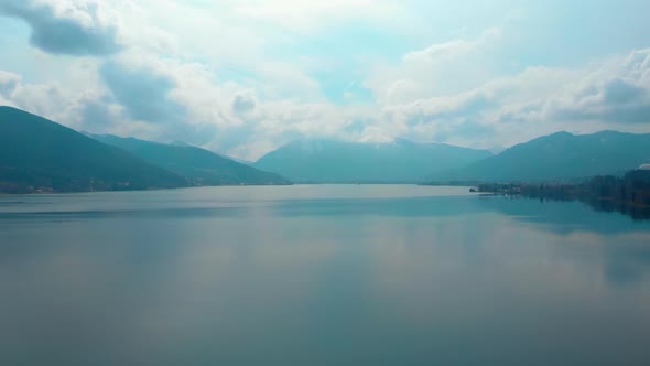 Ascending aerial shot, showing the Tegernsee in bavaria on a cloudy day, view towards Rottach Egern. alt