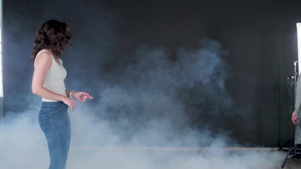 Young Sexy Woman Dancing and Her Partner Approaches and Holds Her alt