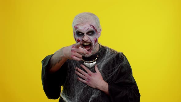 Halloween Zombie Man Pointing Finger to Camera Laughing Out Loud Taunting Making Fun Funny Joke alt