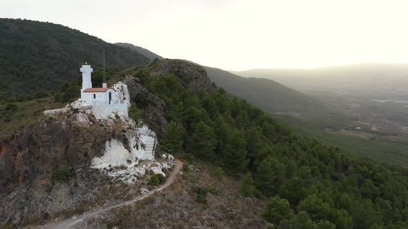 Tiny white church on mountainous hill in Pinos Del Valle, Lecrin Valley, Granada, Spain alt