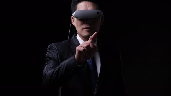 Business man wearing modern VR glassese alt