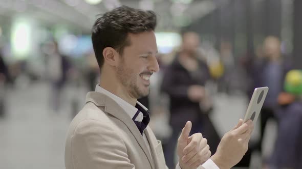 Handsome Male Entrepreneur Searching the Web Online  alt