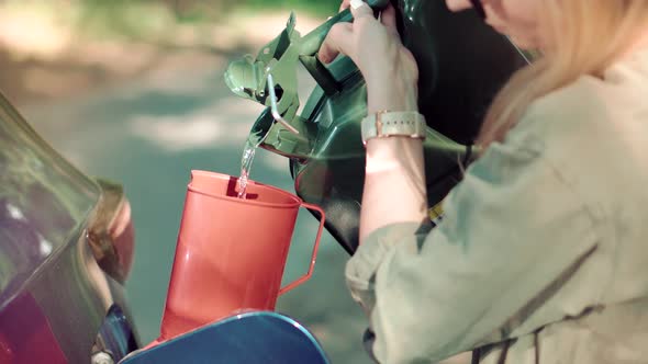 Driver Opens Car Fuel Tank Filling Gasoline. Fill Petrol Benzine On Trip Canister Auto Journey. alt