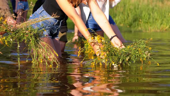 Celebration of Ivan Kupala. Girls and Women Lay Wreaths on the Water. Folk Tradition alt