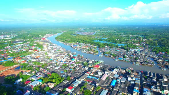 Aerial Shot of Local Fisherman Village Beside the sea alt