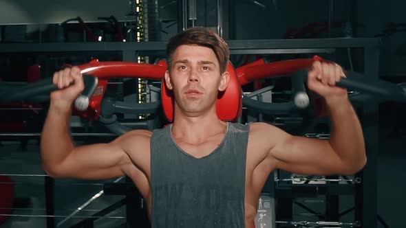 Athletic Young Man Portrait in Gym. Muscular Sportsman Engaging in Bodybuilding. Handsome Body alt