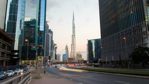 Traffic Dubai with Skyscrapers Time Lapse. Pan Up alt