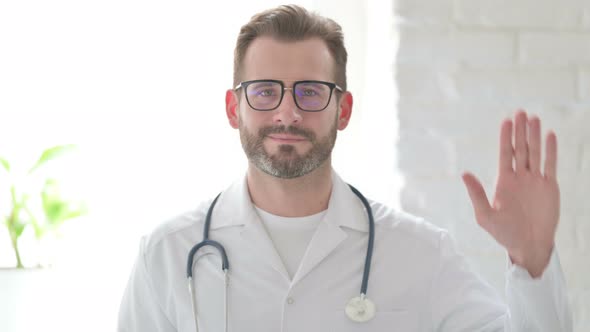 Portrait of Doctor Waving Welcoming alt