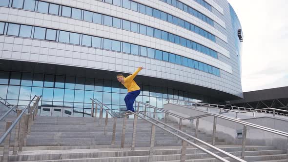 Parkour Young Man Performs a Backflip Over Obstacles in the City and Doing a Flip on Training Area alt