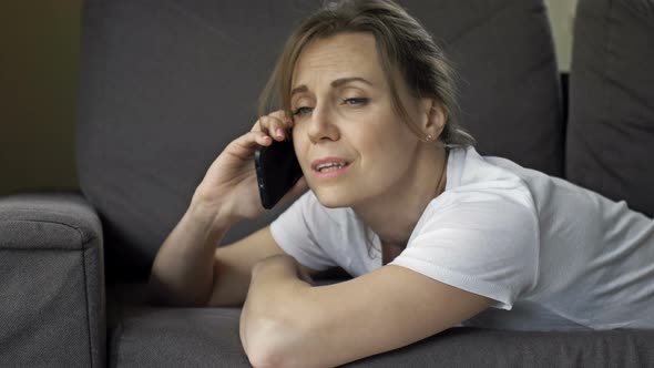 Portrait of a Beautiful Middleaged Woman Talking on a Cell Phone