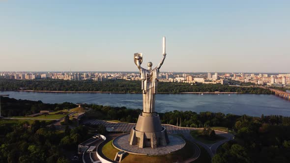 Aerial View of glorious The Motherland Monument located on the banks of Dnieper River alt
