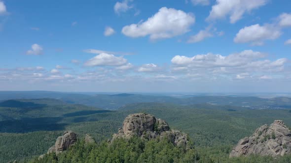 Aerial Hyperlapse of Rocky Peaks and Forest in the Siberian Nature Reserve Stolby