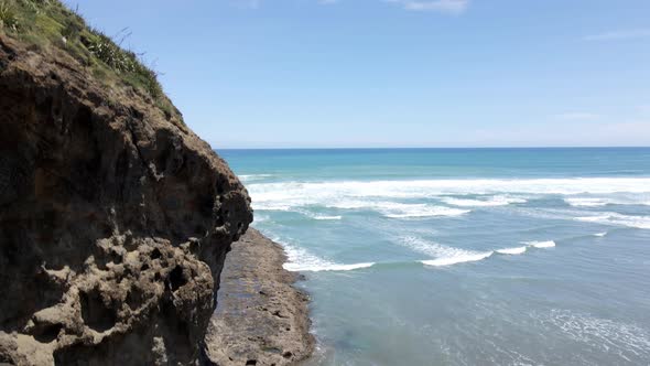 Rugged And Beautiful Coastline At Bethells Beach In The Auckland Region, New Zealand - aerial ascend alt