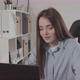 Girl in a Modern Office Working on a Laptop - VideoHive Item for Sale