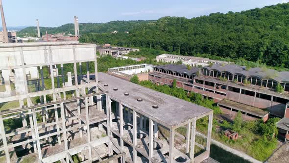 Exterior Abandoned Factory Hall In Loznica Serbia Flight Over Chimneys Aerial Drone Shot 03