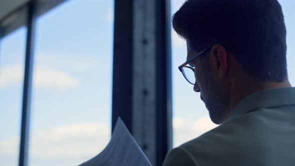 Closeup Professional Reading Contract Rear View alt