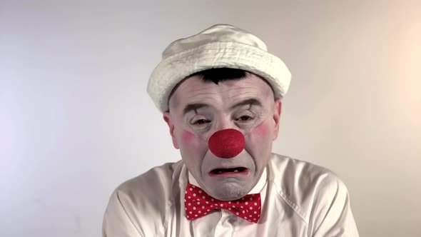 Emoji Clown - Crying Face. A sad mime clown with a big tear running from one eye, down the cheek slo alt