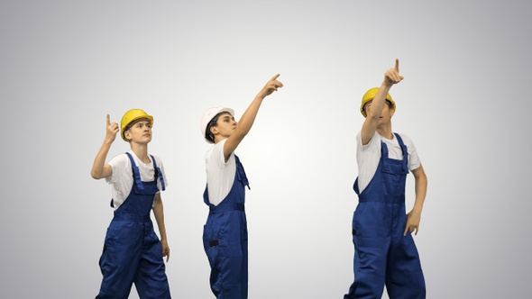 Three construction workers walking in a funny dacning way alt