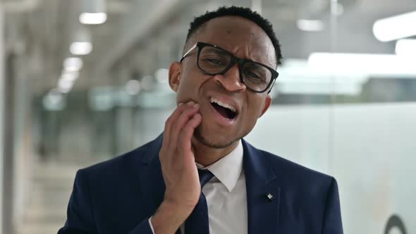 Portrait of Sick Young African Businessman Having Toothache alt