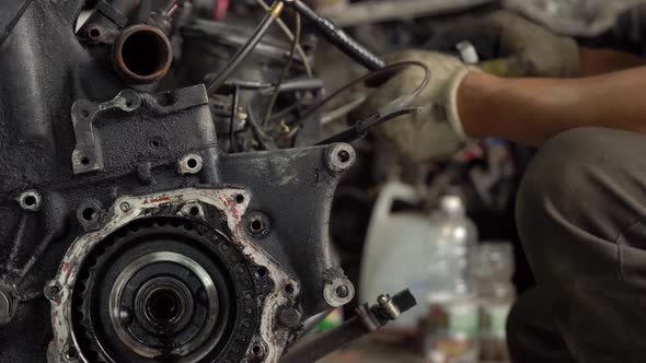 Internal combustion engine, diesel fuel, close-up. He's covered in black oil. alt