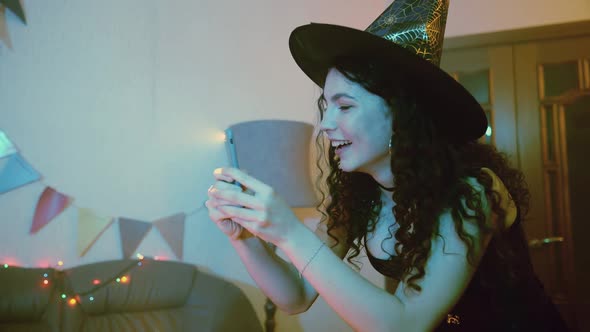 A Girl Takes Pictures or Takes Pictures on Her Friends' Phone for Halloween alt