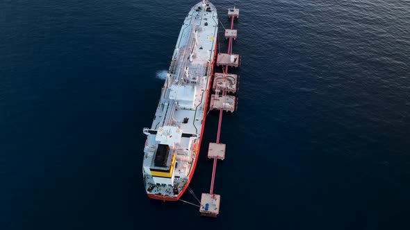 A gas tanker is anchored at sea aerial view 4 K alt