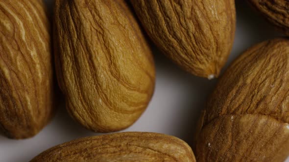 Cinematic, rotating shot of almonds on a white surface - ALMONDS 005 alt