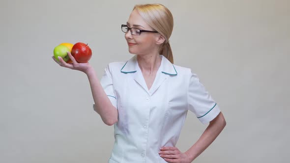 Nutritionist Doctor Healthy Lifestyle Concept - Holding Fresh Natural Organic Fruits alt