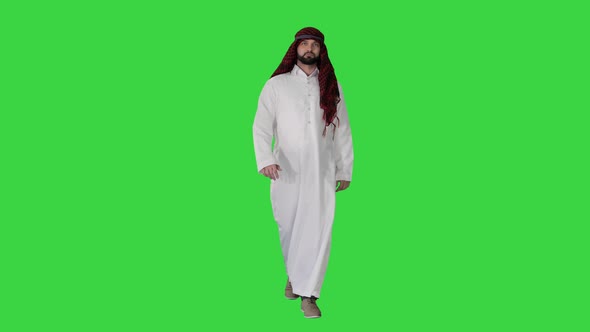 Serious Sheikh Having a Walk on a Green Screen, Chroma Key. alt
