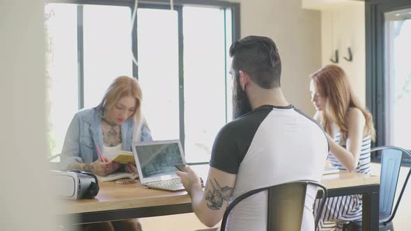 People sitting at table working together
